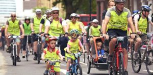 Families in yellow hi-viz on the London FreeCycle bike ride